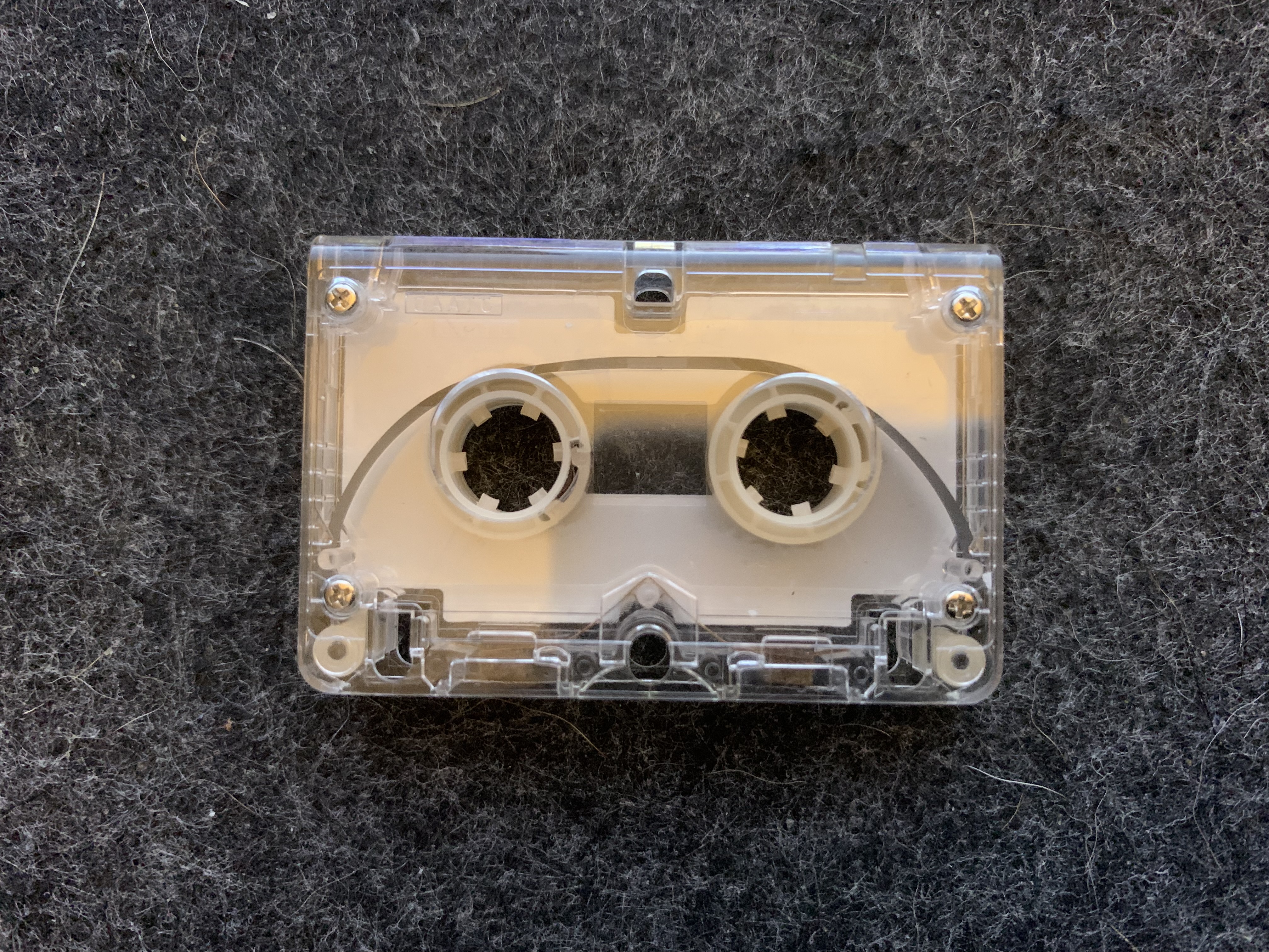 A microcassette tape loop sitting on a desk