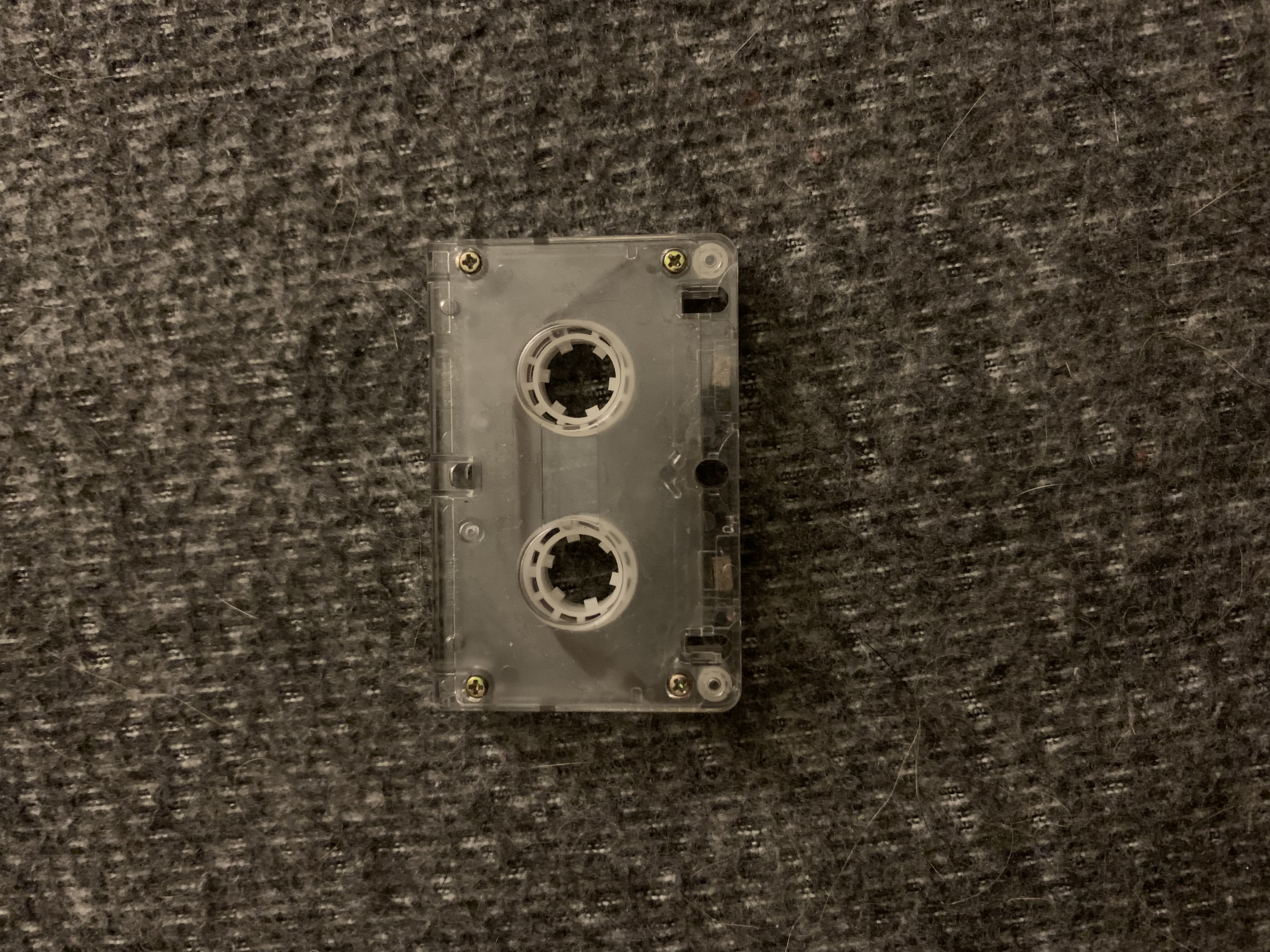 A microcassette tape loop sitting on a desk