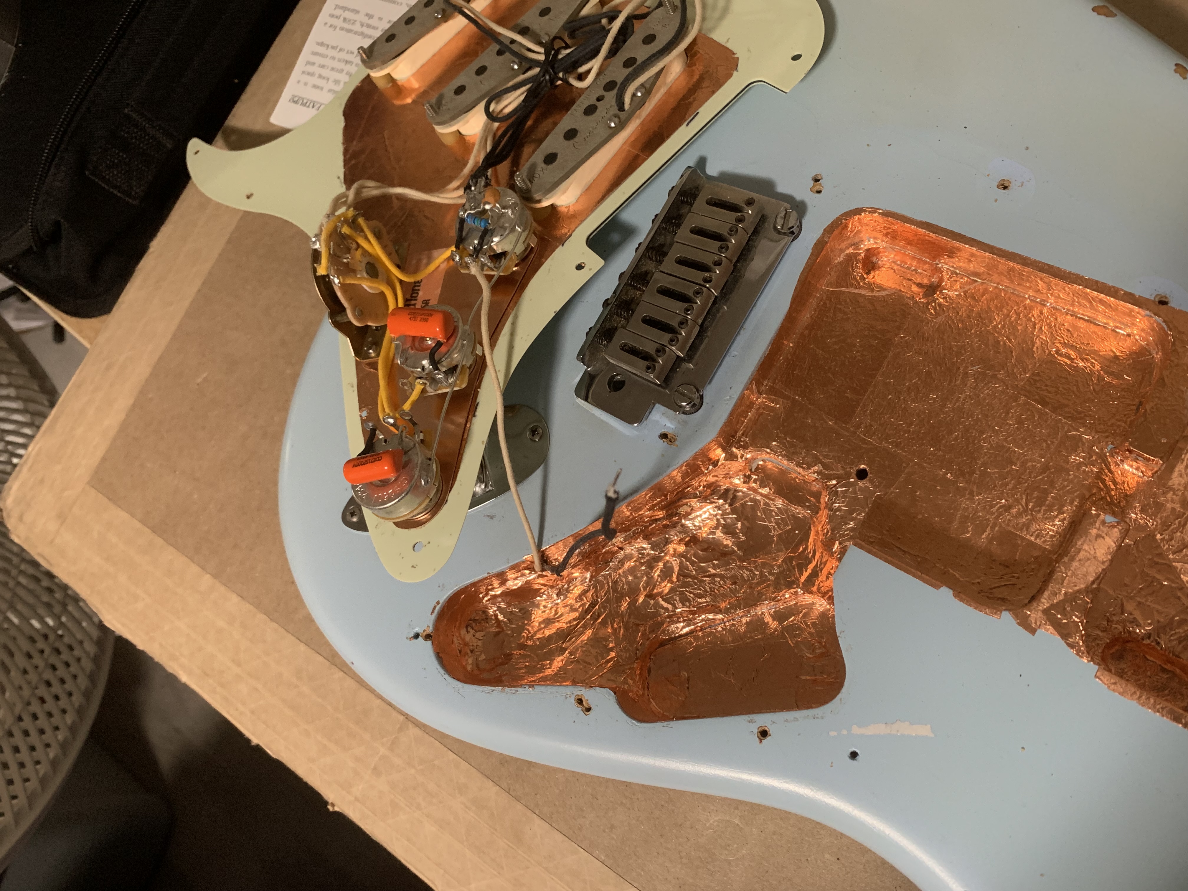 Guitar with close up of wiring harness