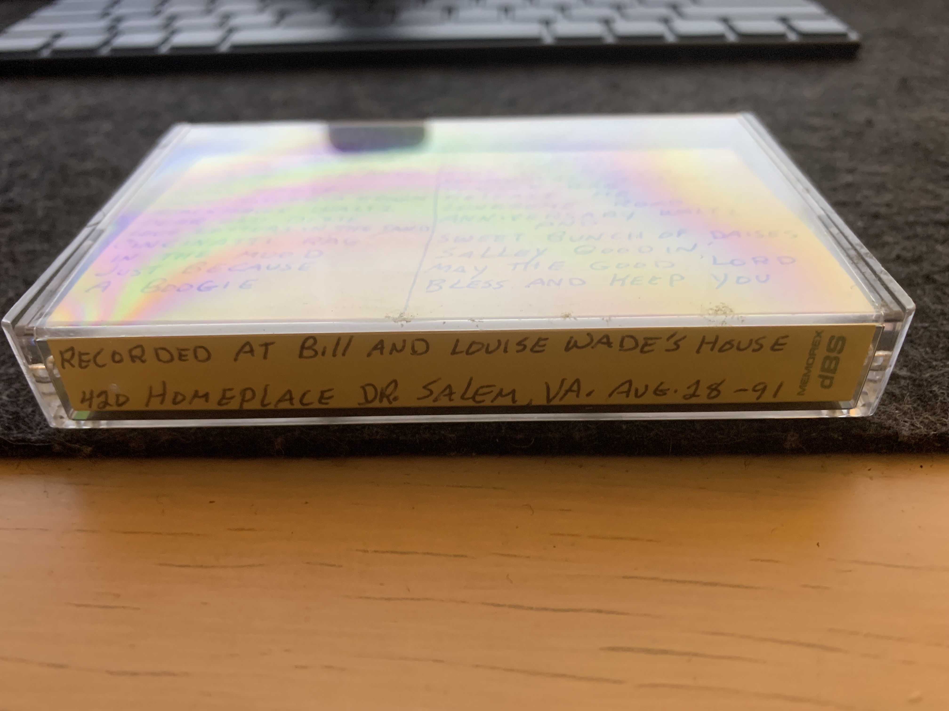 A cassette tape in a tape player on a desk