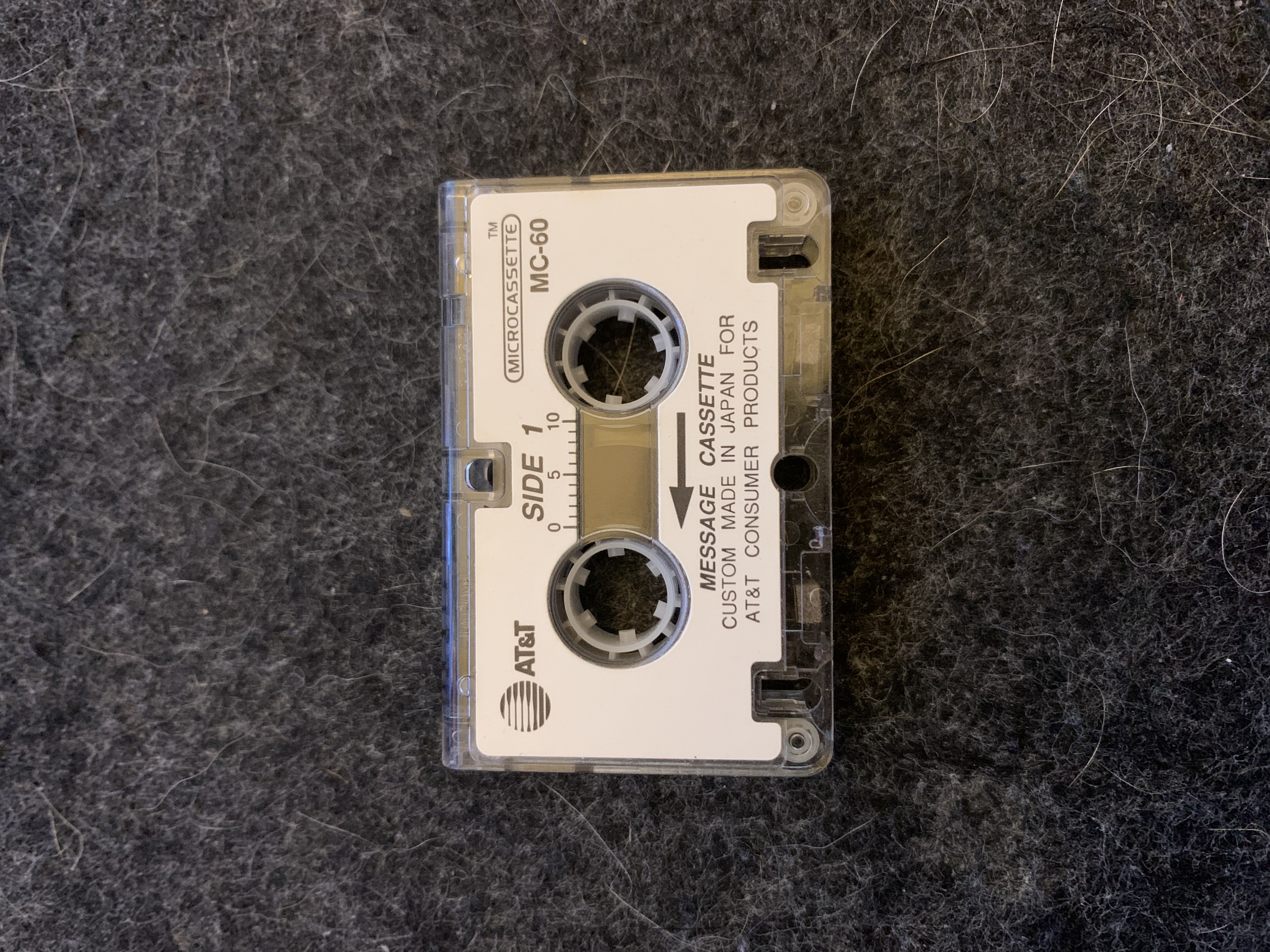 A microcassette sitting on a desk