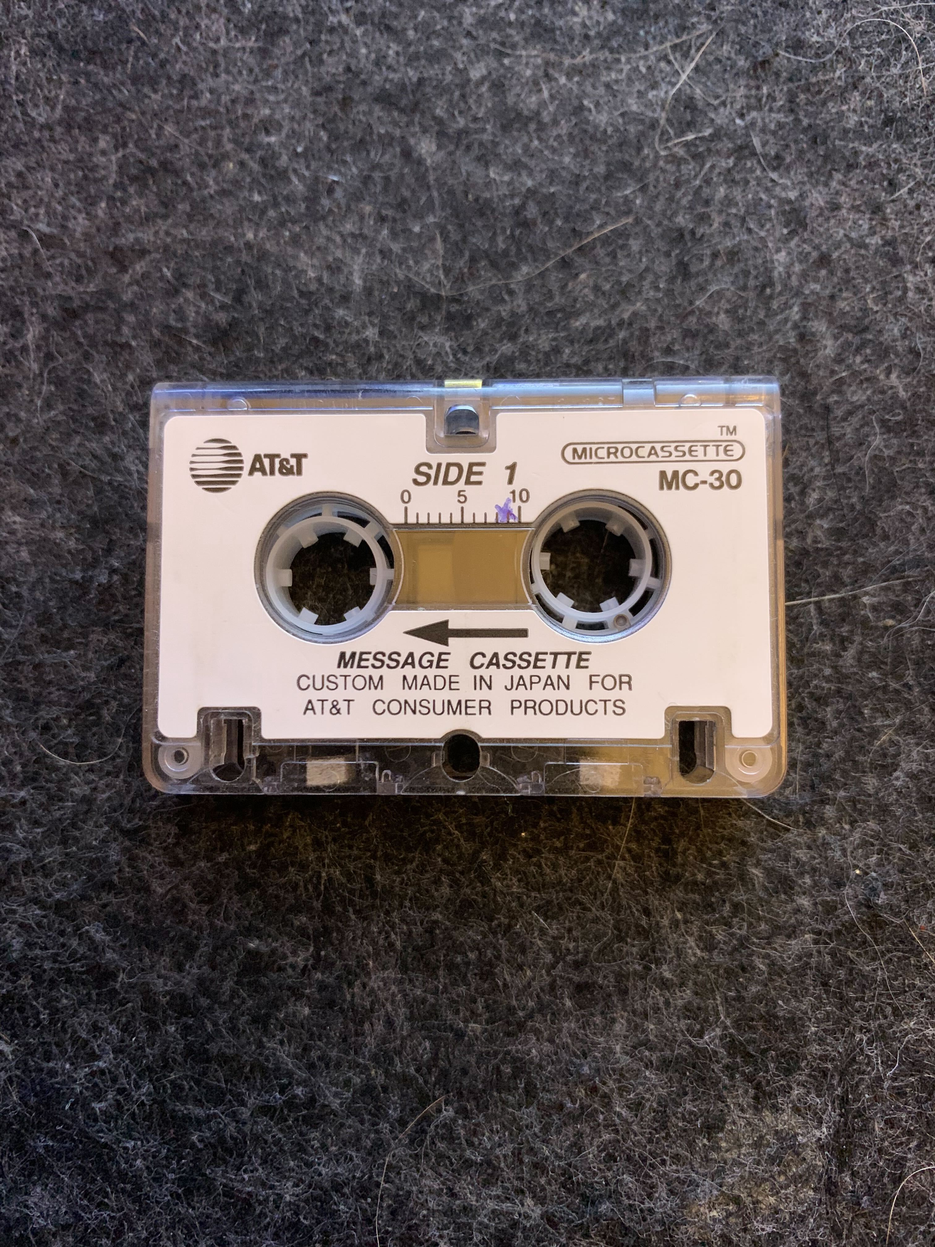A microcassette sitting on a desk